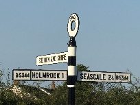 Traditional black and white fingerpost sign