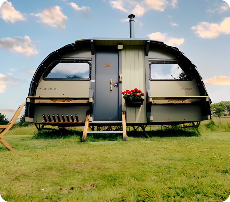 Modern glamping caravan with flower box