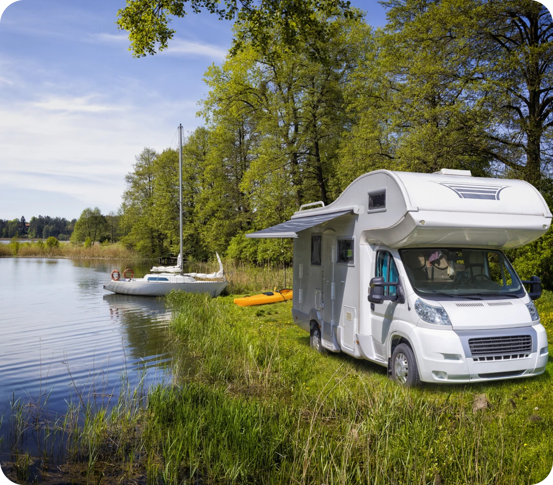 Campervan by a tranquil lakeside